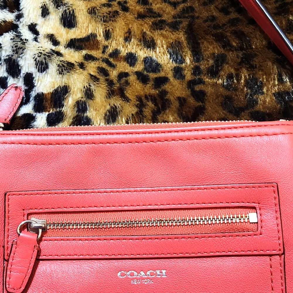 Coach crossbody in Salmon color.